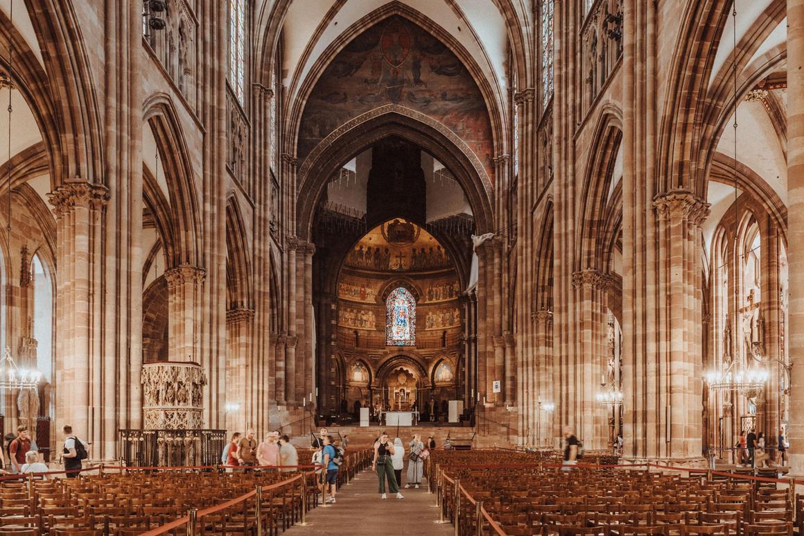 The Gothic nave of Strasbourg Cathedral in pink stone looking east to the choir