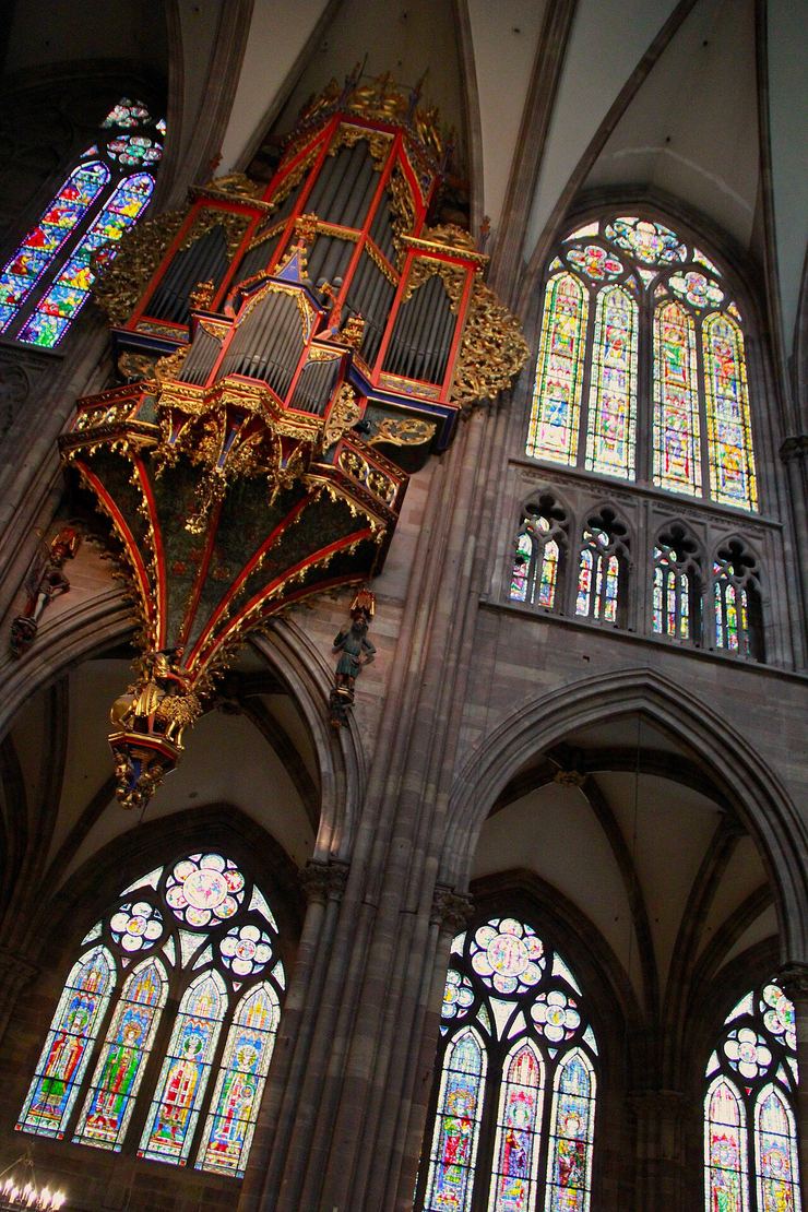 The swallow's-nest organ case hanging high on the wall of the nave in Strasbourg Cathedral