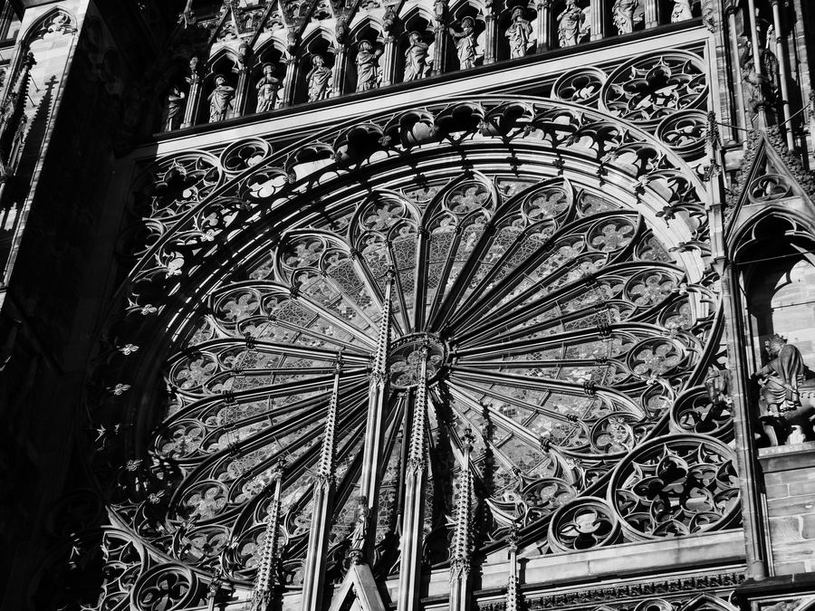 Black-and-white close view of the great rose window and stone tracery of Strasbourg's west front