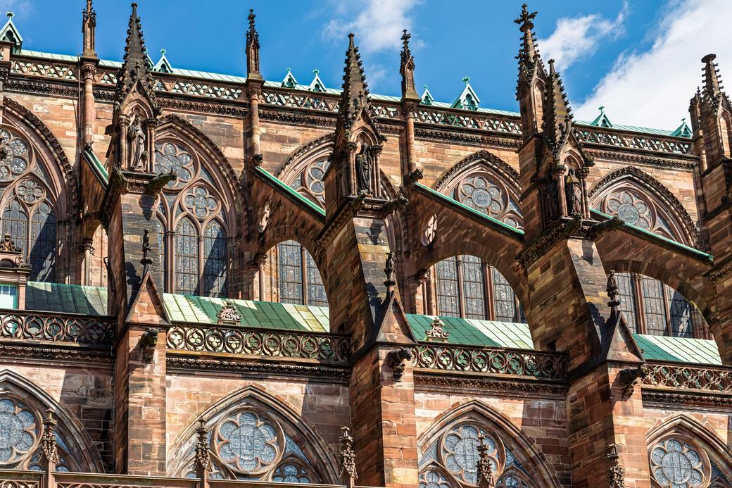 The south side of Strasbourg Cathedral with pinnacles, flying buttresses and green roofs