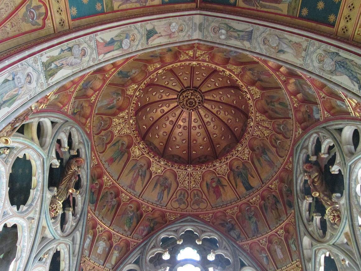 The painted and gilded dome-like ceiling of the chancel at St Mary's Church, Studley Royal