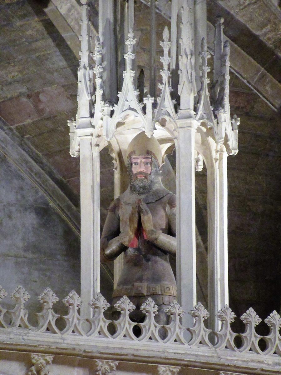 The painted kneeling effigy of Edward Despenser under a canopy at Tewkesbury Abbey