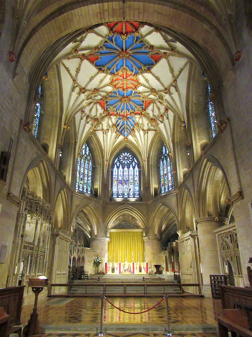 The presbytery of Tewkesbury Abbey with fourteenth-century stained glass and a painted vault