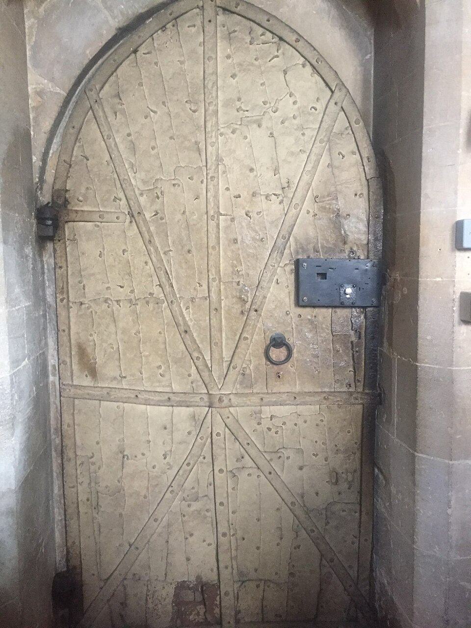 The old wooden sacristy door at Tewkesbury Abbey