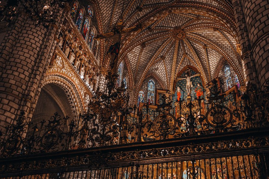 Elaborate iron grilles and Gothic vaults inside Toledo Cathedral