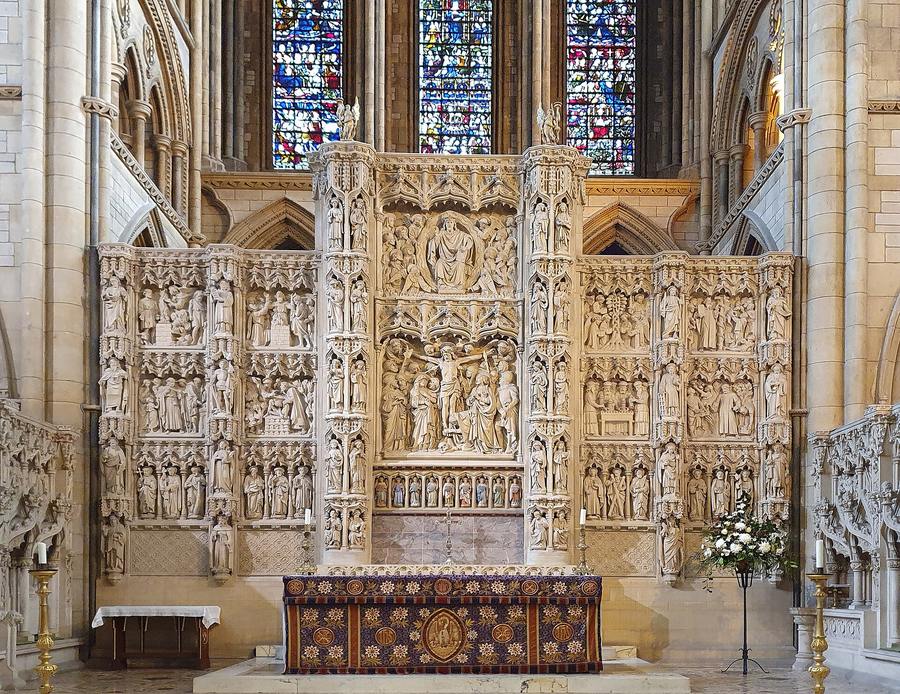 The carved Bath stone reredos behind the high altar of Truro Cathedral, full of figures