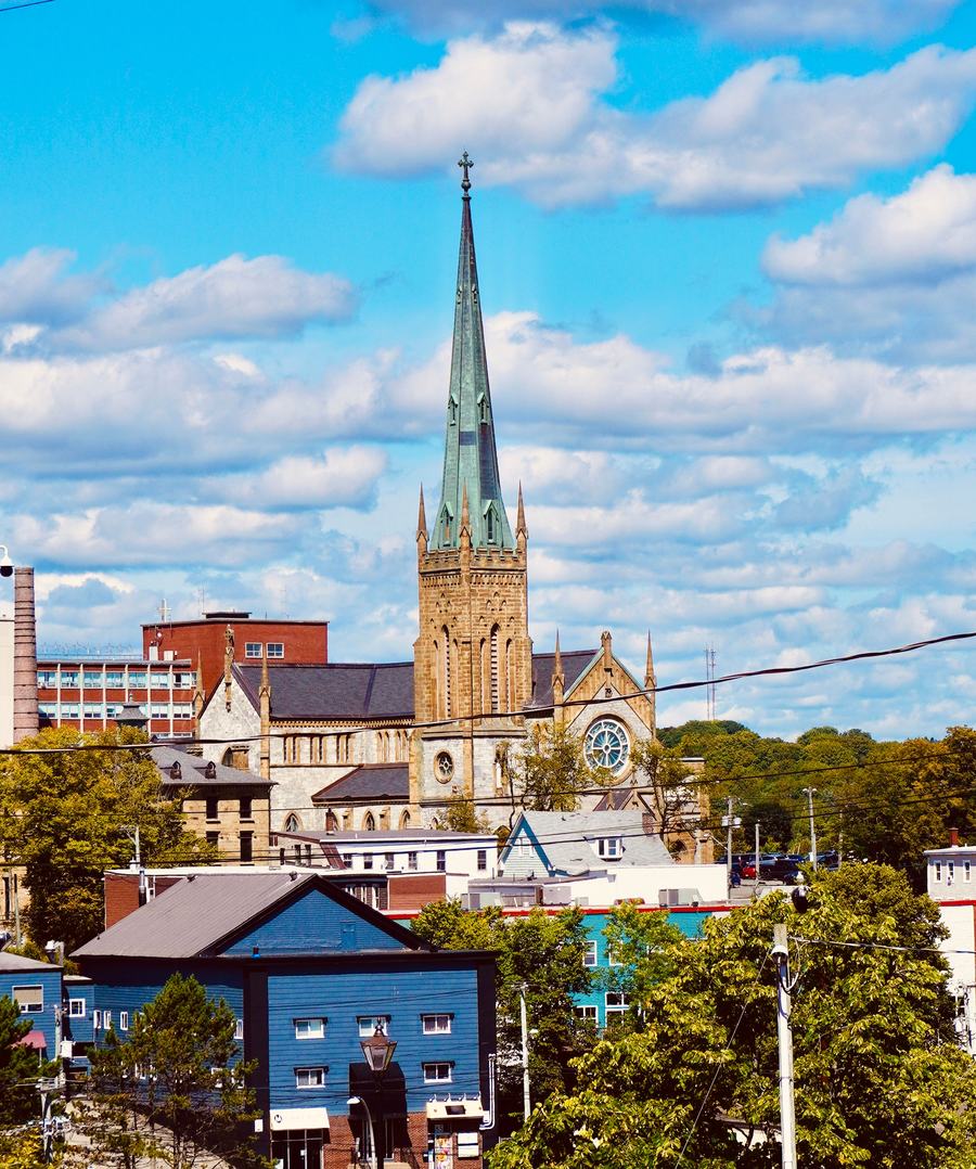 The central spire of Truro Cathedral above the streets and buildings of the city