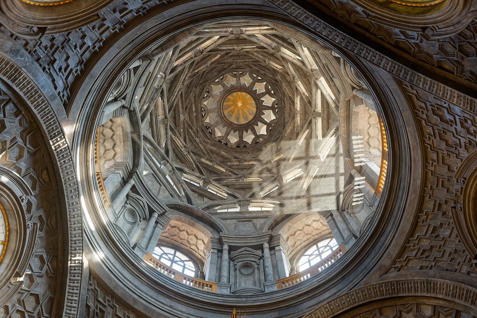 Looking up into Guarino Guarini's dome of the Chapel of the Holy Shroud, a cone of stacked hexagonal ribs rising to a star