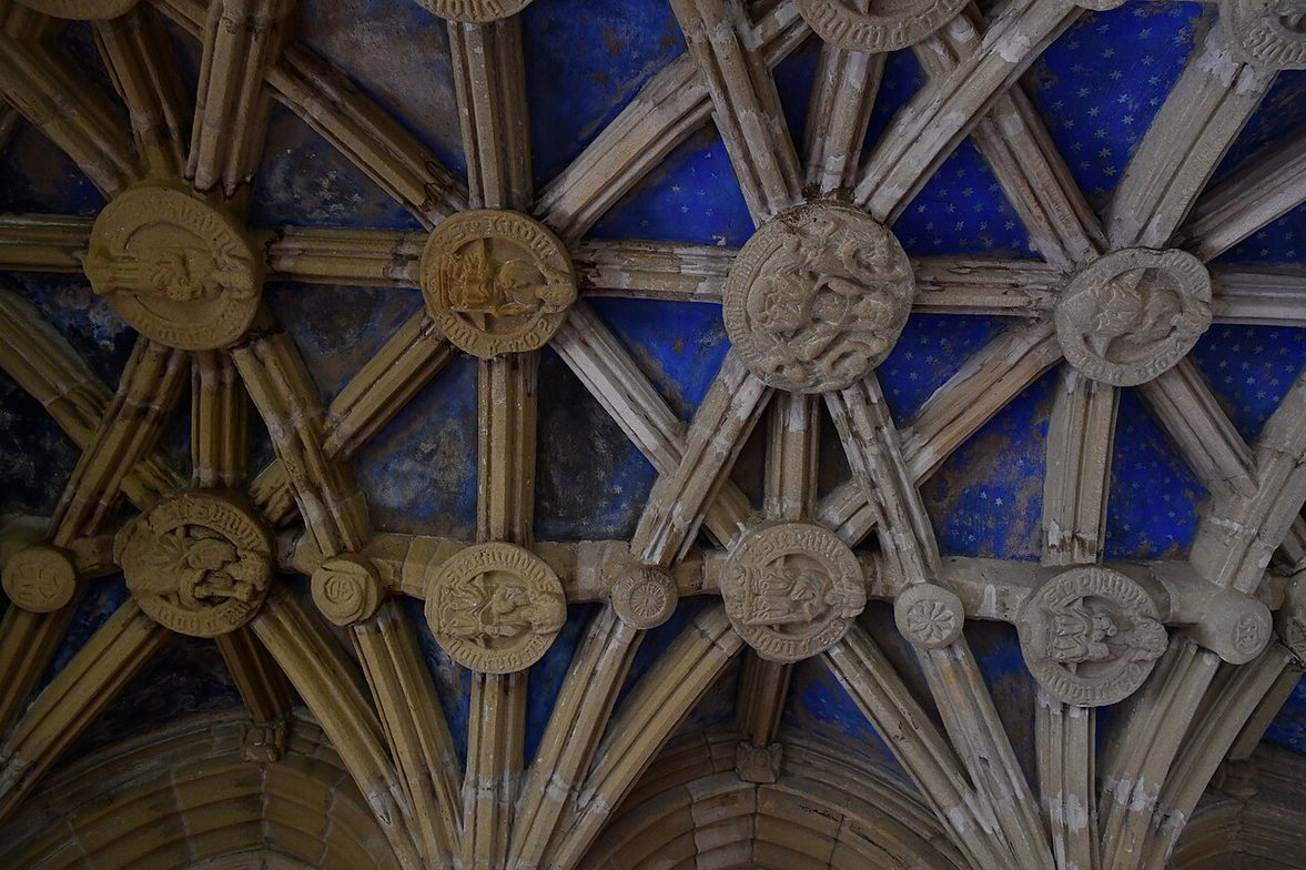 The rib vault of the Percy Chantry at Tynemouth, studded with carved and painted stone bosses