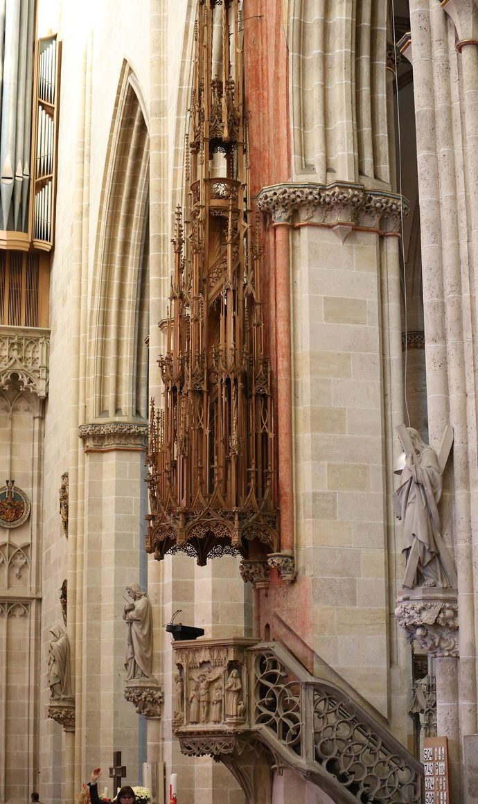 The pulpit of Ulm Minster with its tall carved wooden canopy of Gothic pinnacles
