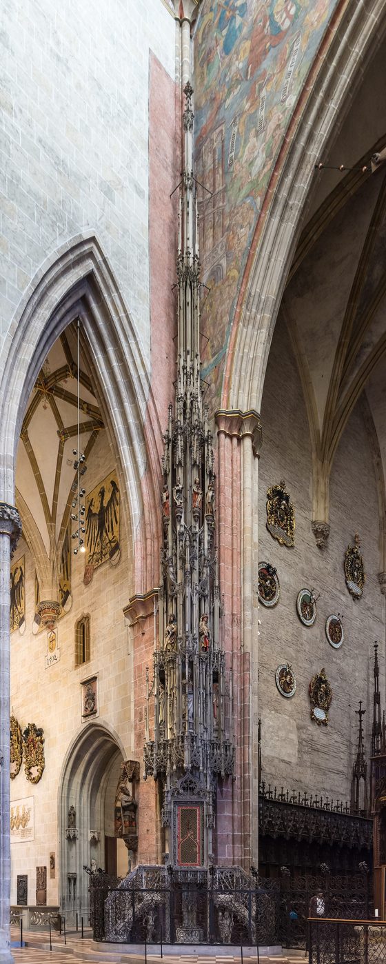 The tall slender stone sacrament house in Ulm Minster, carved with pinnacles and figures