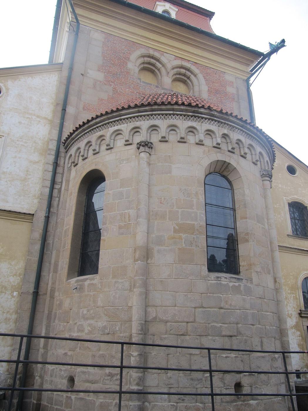Close view of the Romanesque stonework and round-headed windows of the apse at Velehrad