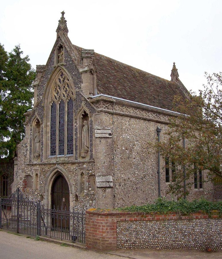 The Slipper Chapel at Houghton St Giles, a small fourteenth-century flint and stone chapel with a large window