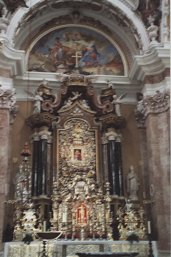 The high altar of the Wieskirche with marbled columns, gilded statues and an altar painting, under painted vaults