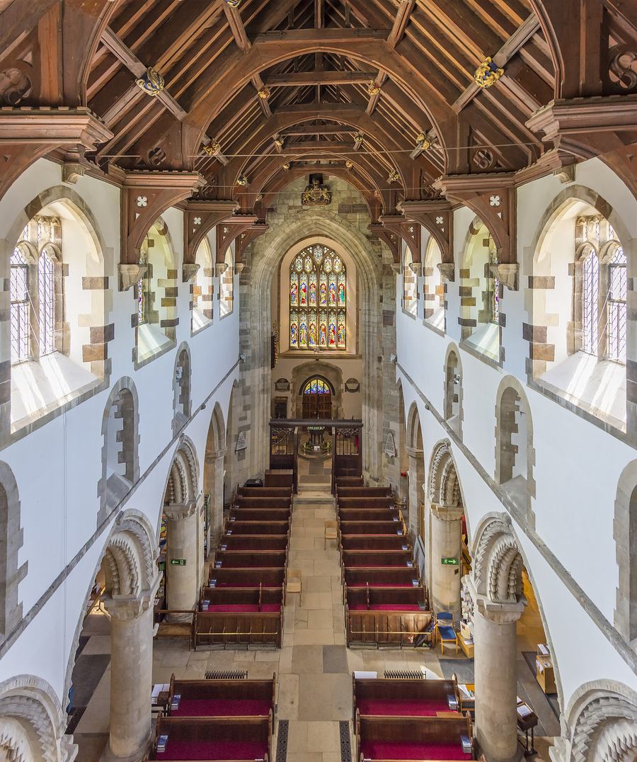 Looking down the nave of Wimborne Minster from a high gallery