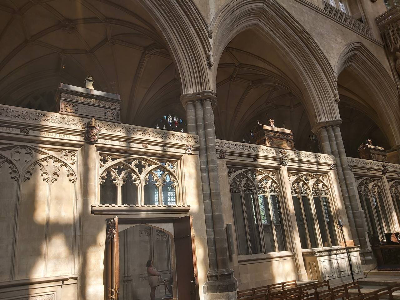 Painted mortuary chests on the stone screens beside the presbytery at Winchester Cathedral