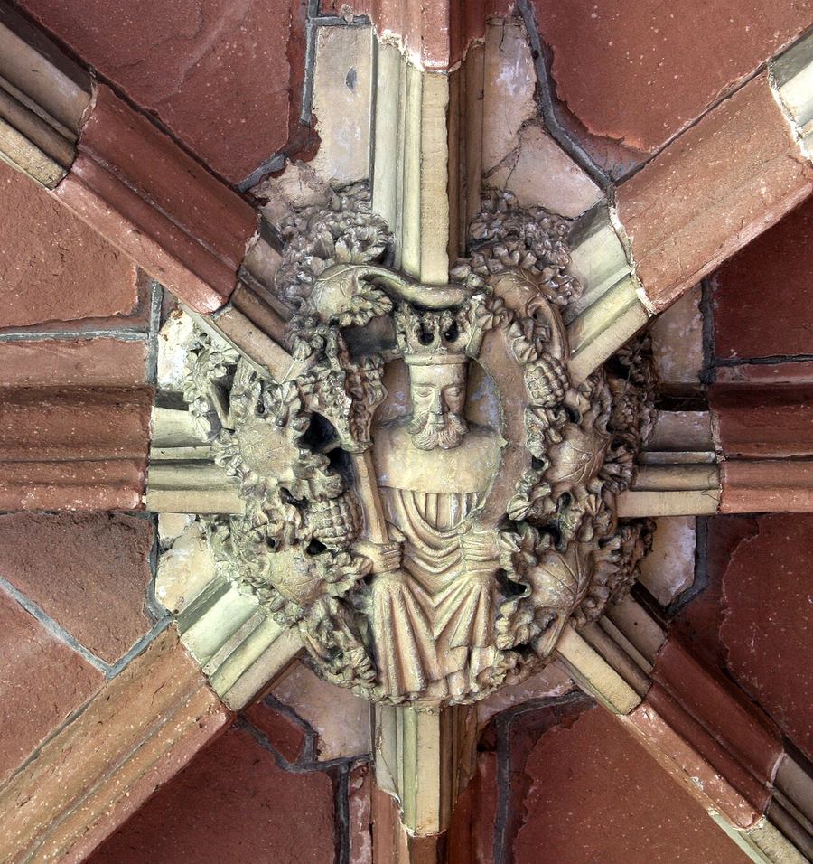 A carved royal roof boss in the cloister vault at Worcester Cathedral