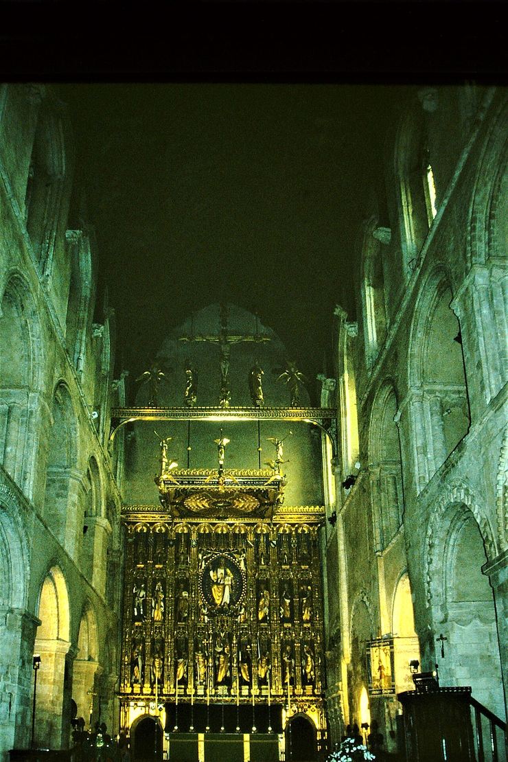 Looking east along the Norman nave of Wymondham Abbey to the gilded reredos
