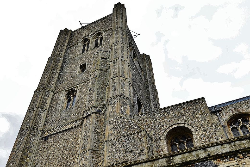The tall square west tower of Wymondham Abbey, built by the parishioners