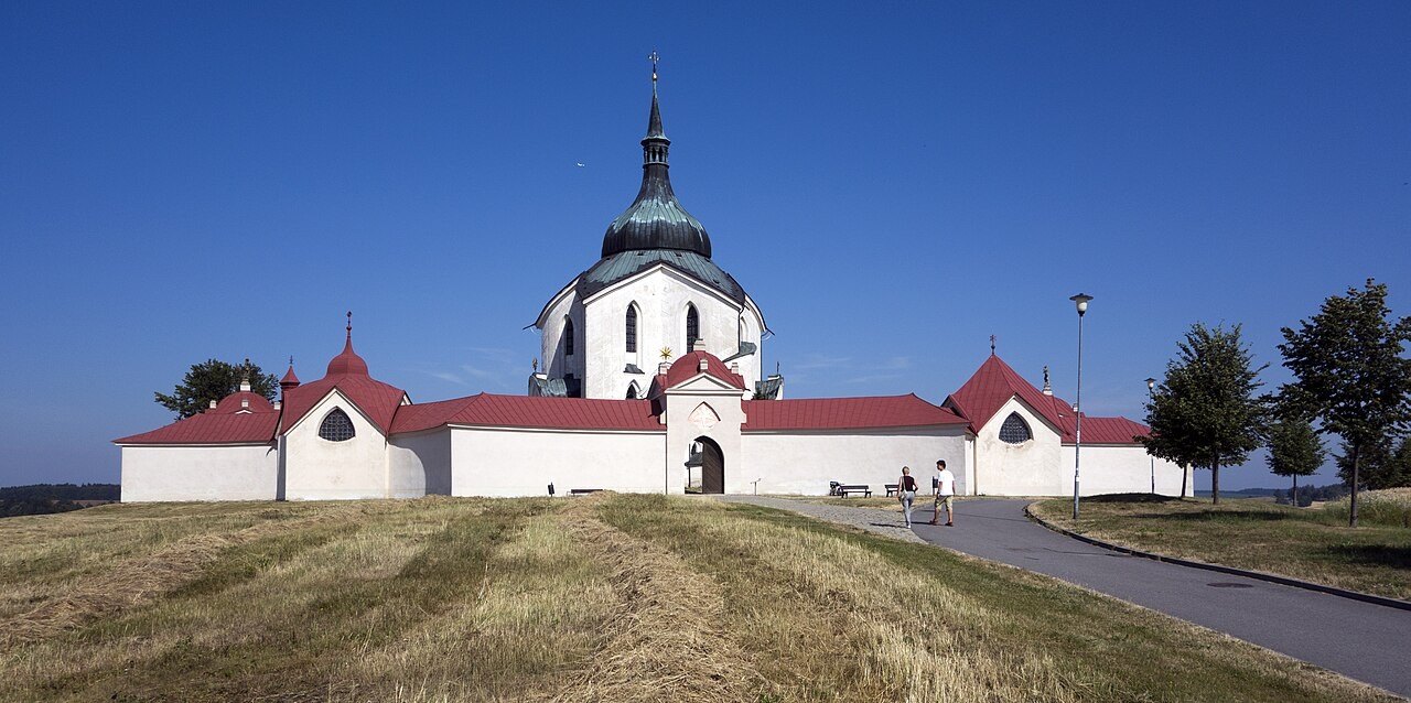 The white star-shaped pilgrimage church of St John of Nepomuk at Zelená Hora inside its ring of red-roofed cloister