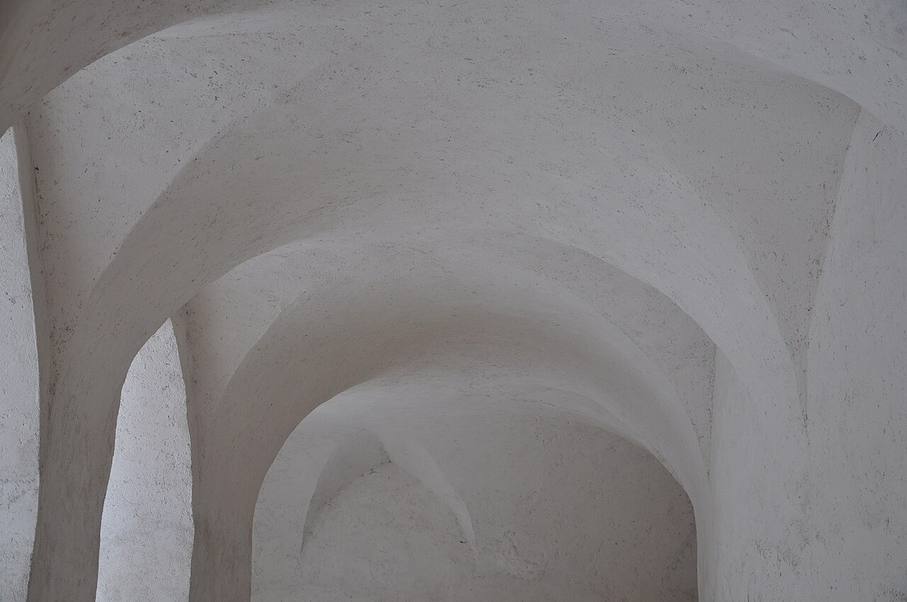 The white vaults of the cloister passage around the Zelená Hora church