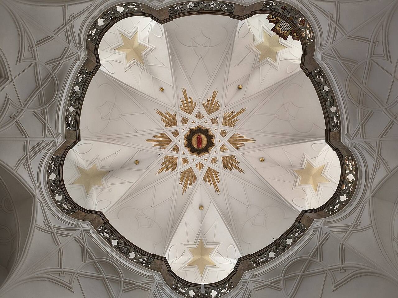The star-patterned rib vault of the Zelená Hora church seen from below